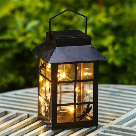 Solar lanterns at lowes - Learn More. Overview. Light up your outdoor living space with this traditional design solar shepherd hook light with crackled glass lens. Can be installed in ground or used as a tabletop light. Perfect for your outdoor living space, includes rechargeable battery and stake. Traditional design 20 lumens solar light. Features crackled glass design.